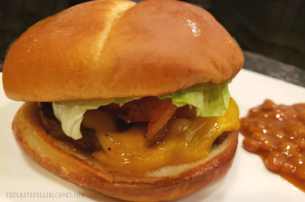 A juicy, hot air fryer bacon cheeseburger, ready to devour.