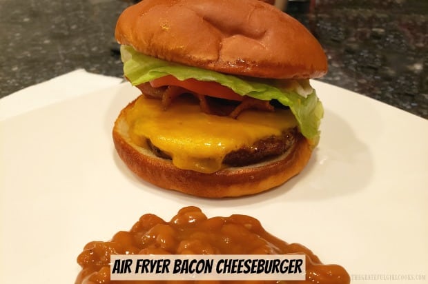 Learn how easy it is to make a juicy good Air Fryer Bacon Cheeseburger, using this appliance. Can't get outside to grill? Use an air fryer instead!