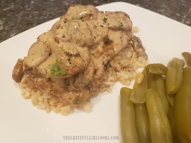 The chicken thighs were served on brown rice, with green beans on the side.
