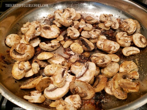 Sliced mushrooms are first cooked in skillet to begin creating a sauce.