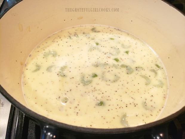 The potato chowder has thickened, is heated through, and is ready to serve.