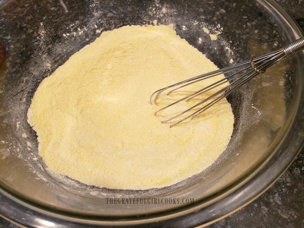 Flour, cornmeal and other dry ingredients are whisked together to mix.