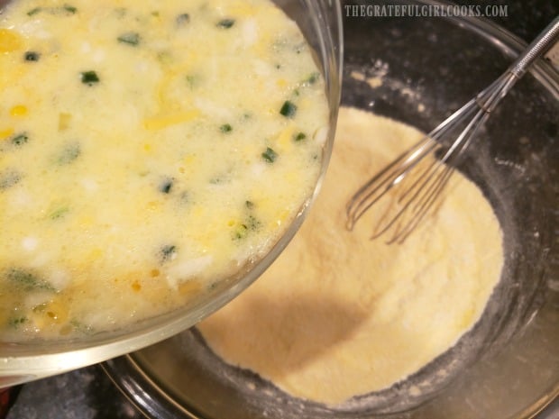 The wet ingredients are poured into the dry ingredients to make a batter.