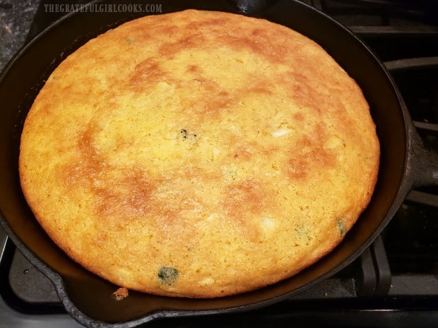 Baked jalapeño cheddar cornbread is golden brown on the top.