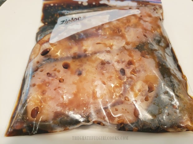 Boneless, skinless chicken breasts are marinated in teriyaki sauce.