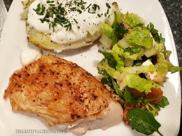 Roast chicken and baked potato are served with the tossed beet and goat cheese salad.
