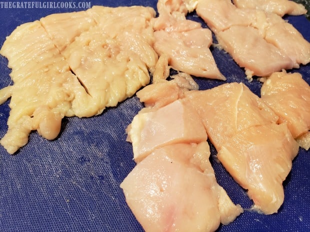 Pieces of chicken breast are cut into halves, then into thirds before cooking.