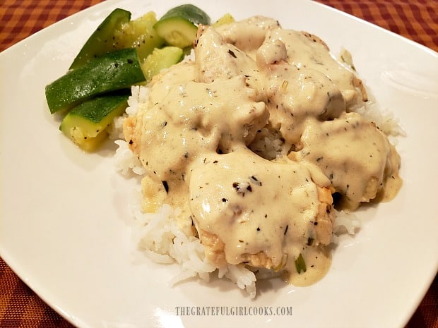 Creamy Lemon Tarragon Chicken is served on rice, with zucchini on the side.