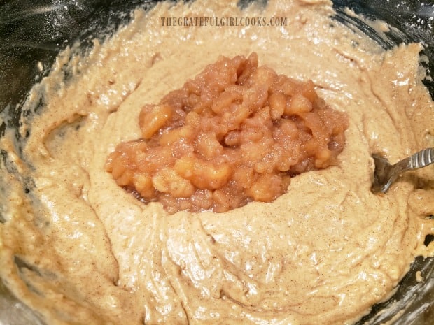 Apple pie filling is stirred into the batter for the doughnuts.