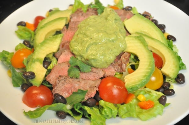 Dollop a steak salad with avocado cilantro lime dressing to finish.