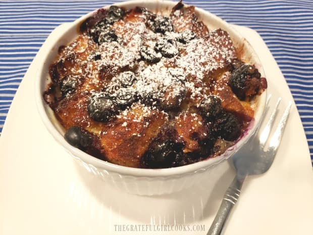 Powdered sugar is sifted over the top of the french toast cup before serving.