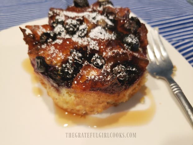 The blueberry french toast cup (with syrup) has been removed from the ramekin.