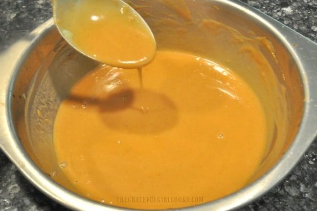 Peanut sauce is mixed together in a small bowl before adding to noodles in peanut sauce.