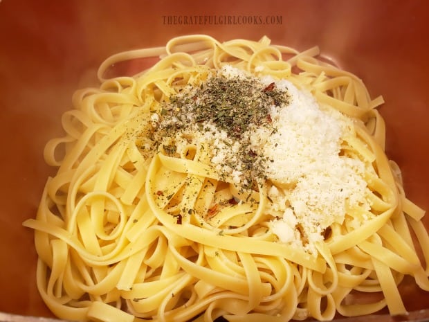 The herb mixture, butter, oil and Parmesan cheese are added to cooked pasta.