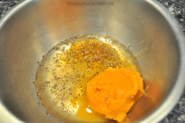 Spices, white wine vinegar and pumpkin puree are measured into a small bowl.