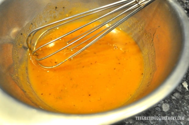 The ingredients for pumpkin vinaigrette are whisked together until blended.