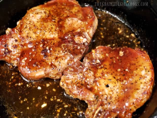 Chops are added to sauce, and covered with sauce before baking.