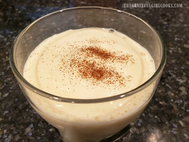 The coconut pineapple smoothie has a sprinkle of ground cinnamon on top for garnish.