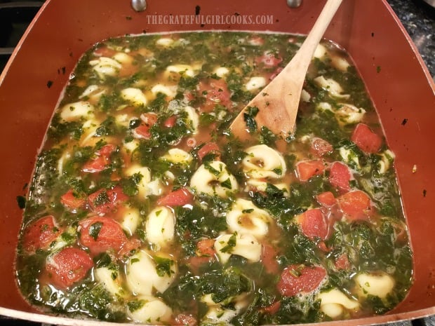 The easy tortellini soup is cooked until heated through.