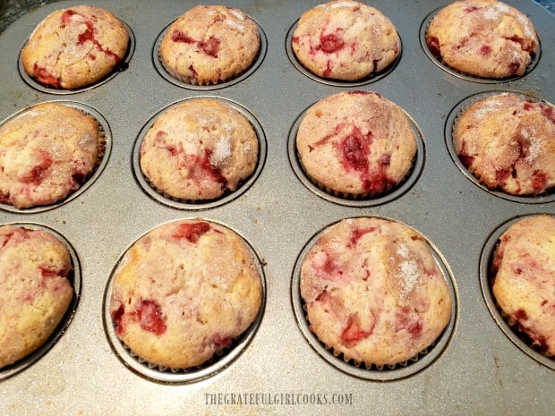 Baked fresh strawberry muffins, hot from the oven.