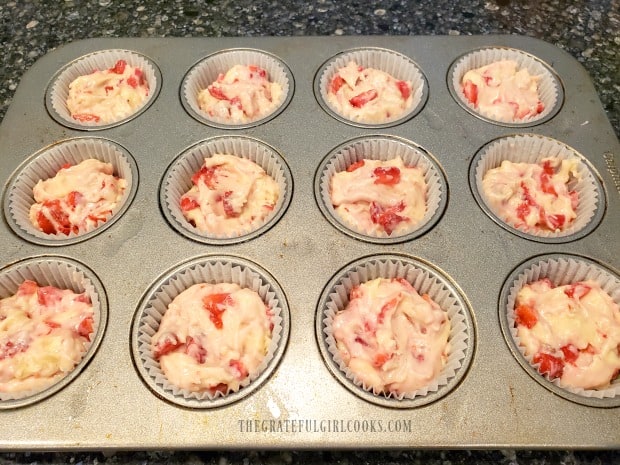 Batter is placed into greased paper liners in muffin tin.