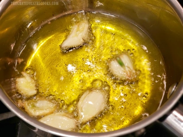 Garlic-infused olive oil is cooking away in the pan.