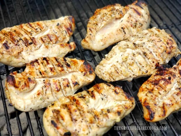 The chicken is turned half way through grilling to brown both sides.