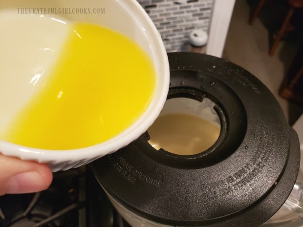 Melted butter is streamed into the batter, a bit at a time.