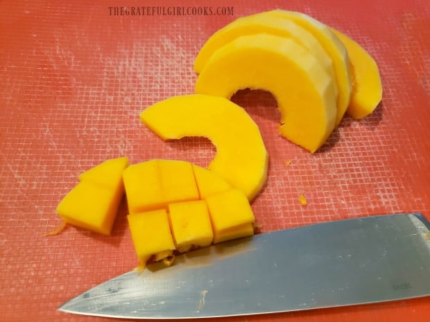 Slice the squash, then cut into small cubes before cooking.
