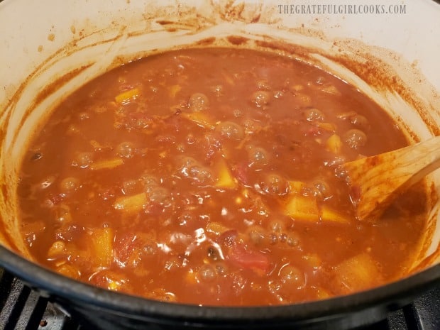 After cooking, the chili will thicken and butternut squash will be tender.