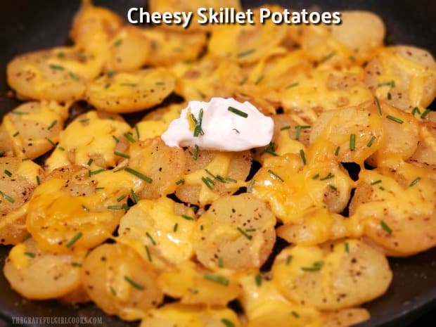 Cheesy Skillet Potatoes are made with Yukon Gold or Butterball potatoes, seasoned w/ butter, spices & cheese, served w/ chives & sour cream.
