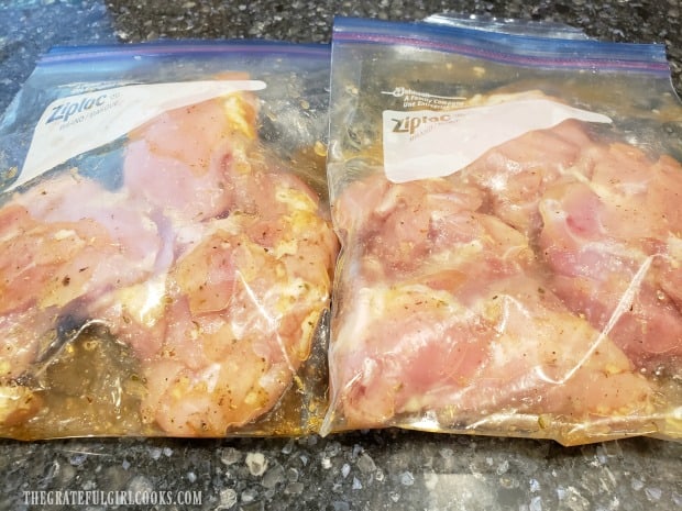 Chicken thighs marinating in honey lime sauce in re-sealable plastic bags.
