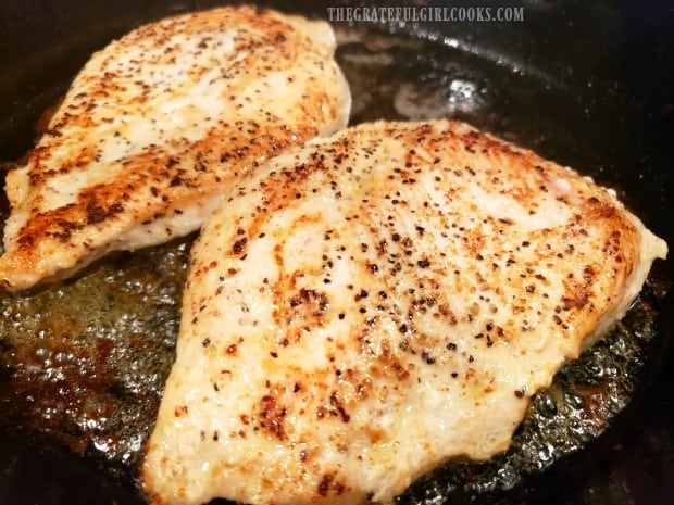 The pan-seared chicken pieces are browned after cooking, and turning to other side.