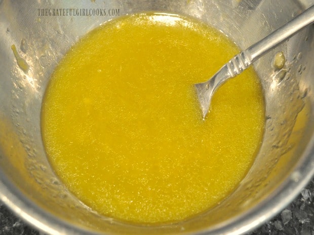 Lemon ginger salad dressing is emulsified and waiting to drizzle on a salad.
