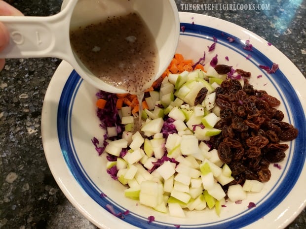 Poppyseed dressing is added, and then coleslaw is gently tossed to combine.