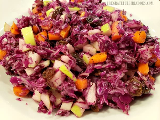 A close up view of the delicious poppyseed apple raisin coleslaw, ready to eat.