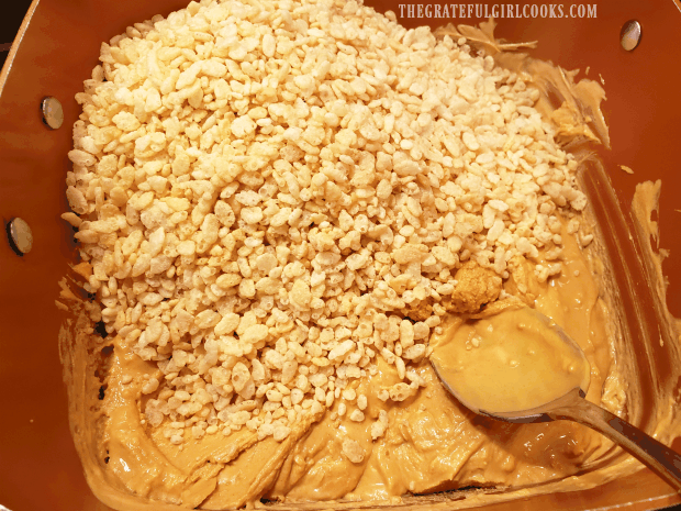 Puffed rice cereal is added to melted butterscotch chips and peanut butter.