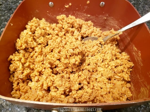The butterscotch krispy mixture is stirred together until fully combined.