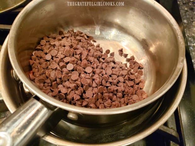 Chocolate chips are melted in a double boiler pan.