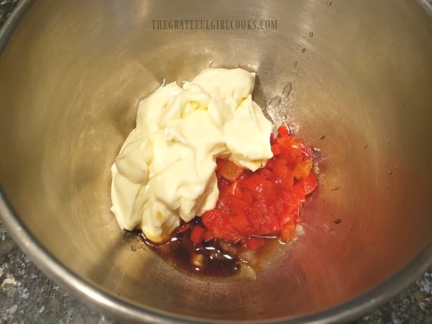 Mayonnaise, pimientos, Worcestershire, onion, and Tabasco sauce in mixing bowl.