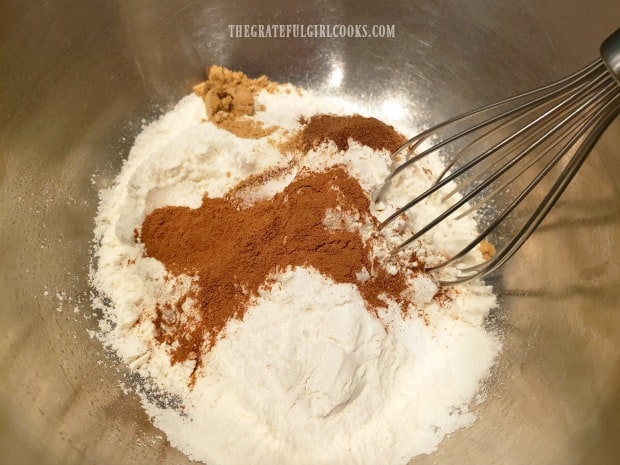 Flour, cinnamon and other spices are whisked together for dry ingredients.