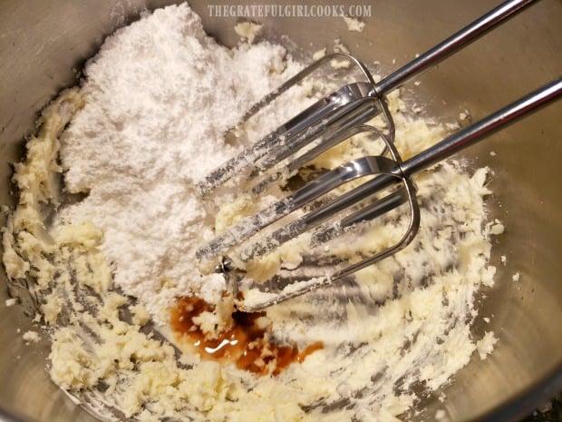 Cream cheese frosting is mixed together to frost the pumpkin bars.