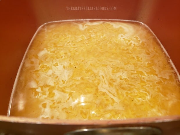 Orzo and chicken broth cook for about 10 minutes in pan.