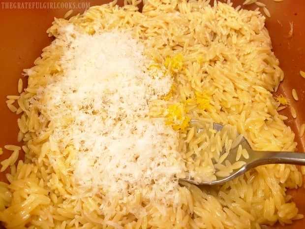 Finely grated Parmesan cheese, lemon zest, juice and pepper are added to cooked orzo.