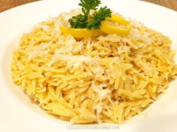 Lemon Parmesan Orzo, garnished with Parmesan cheese, lemon peel and parsley.