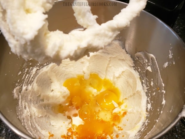 Cream cheese, shortening, sugar, eggs, OJ, and zest are mixed for cookie batter.