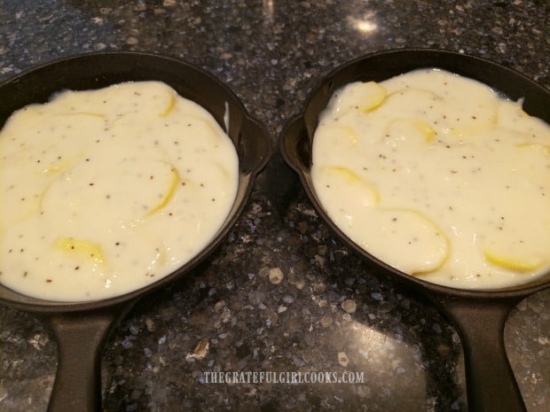 Thickened creamy sauce is poured over the potatoes.