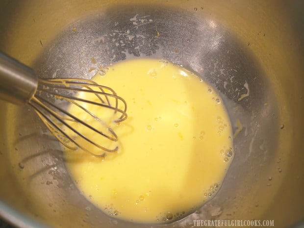Egg yolks, lemon juice and zest are whisked together until combined.