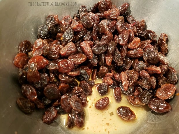 Raisins are soaked in rum before adding to muffin batter.