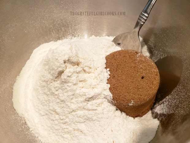 Brown sugar is stirred into sifted flour, baking powder and salt.